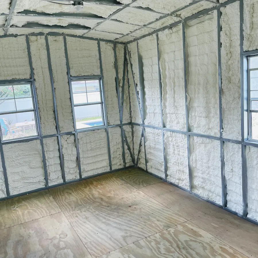 Closed-cell spray foam insulation applied to wall cavities in a residential project in Greenwood